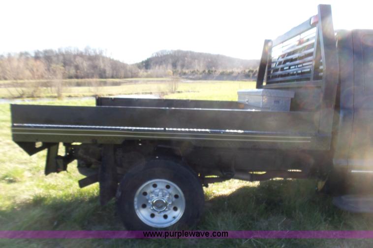 image for item BG9084 2000 Ford F250 Super Duty SuperCab flatbed pickup truck