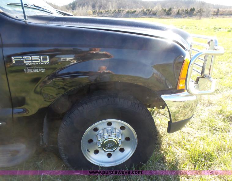 image for item BG9084 2000 Ford F250 Super Duty SuperCab flatbed pickup truck