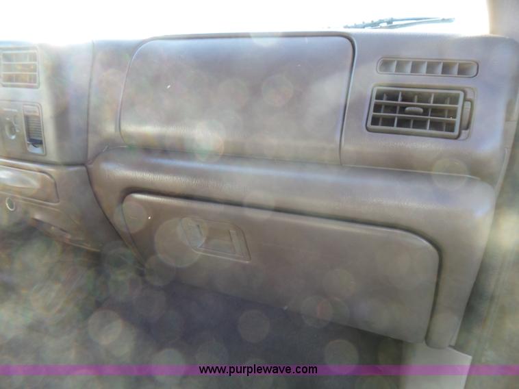 image for item BG9084 2000 Ford F250 Super Duty SuperCab flatbed pickup truck