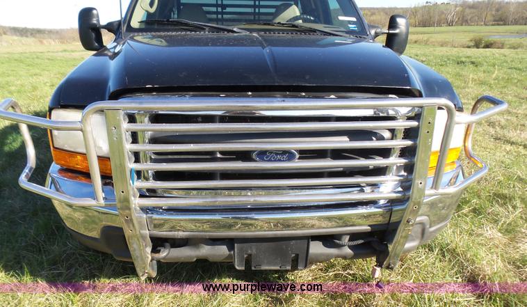 image for item BG9084 2000 Ford F250 Super Duty SuperCab flatbed pickup truck