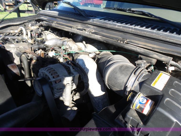 image for item BG9084 2000 Ford F250 Super Duty SuperCab flatbed pickup truck