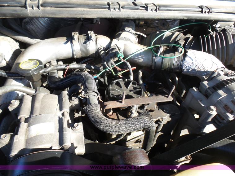 image for item BG9084 2000 Ford F250 Super Duty SuperCab flatbed pickup truck