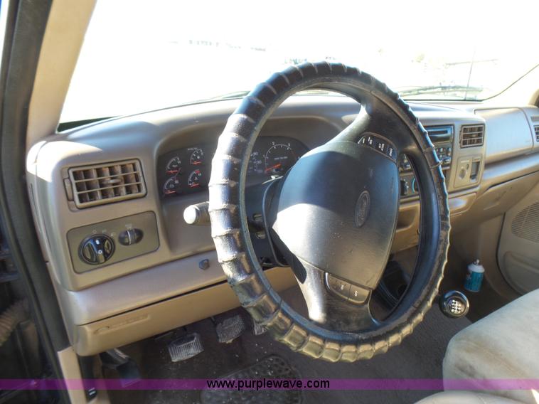 image for item BG9084 2000 Ford F250 Super Duty SuperCab flatbed pickup truck