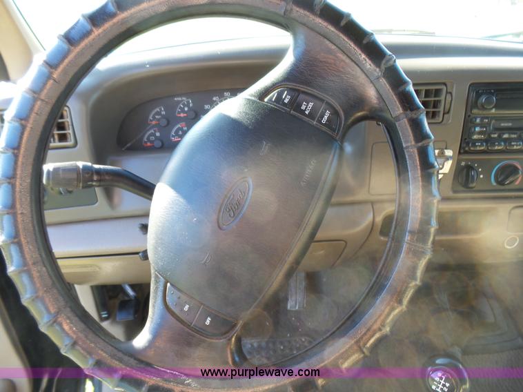 image for item BG9084 2000 Ford F250 Super Duty SuperCab flatbed pickup truck