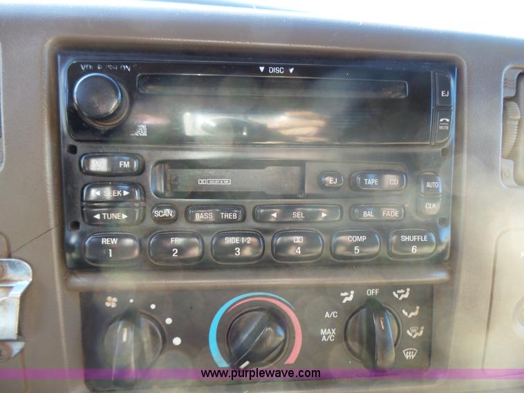 image for item BG9084 2000 Ford F250 Super Duty SuperCab flatbed pickup truck