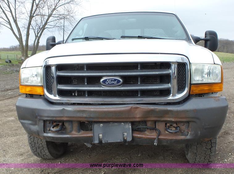 image for item L5690 1999 Ford F250 Super Duty XL Crew Cab flatbed pickup truck