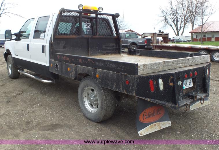 image for item L5690 1999 Ford F250 Super Duty XL Crew Cab flatbed pickup truck