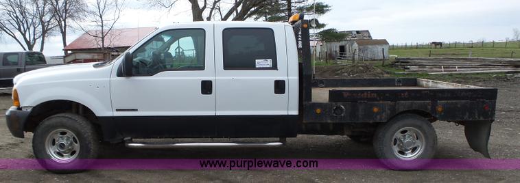 image for item L5690 1999 Ford F250 Super Duty XL Crew Cab flatbed pickup truck