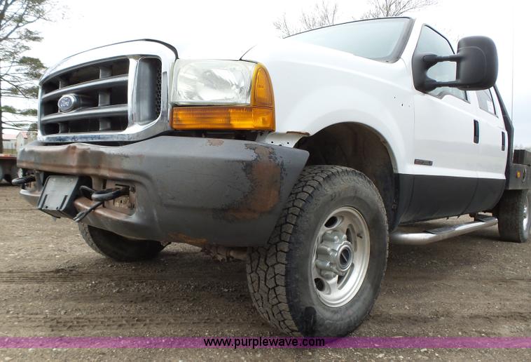 image for item L5690 1999 Ford F250 Super Duty XL Crew Cab flatbed pickup truck