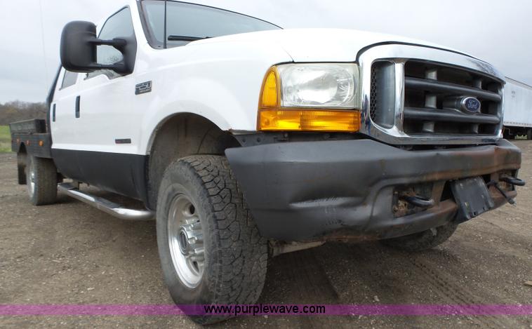 image for item L5690 1999 Ford F250 Super Duty XL Crew Cab flatbed pickup truck