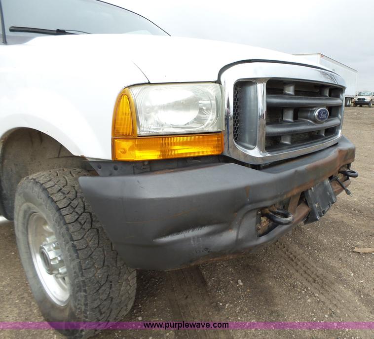 image for item L5690 1999 Ford F250 Super Duty XL Crew Cab flatbed pickup truck