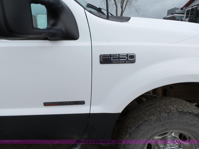 image for item L5690 1999 Ford F250 Super Duty XL Crew Cab flatbed pickup truck