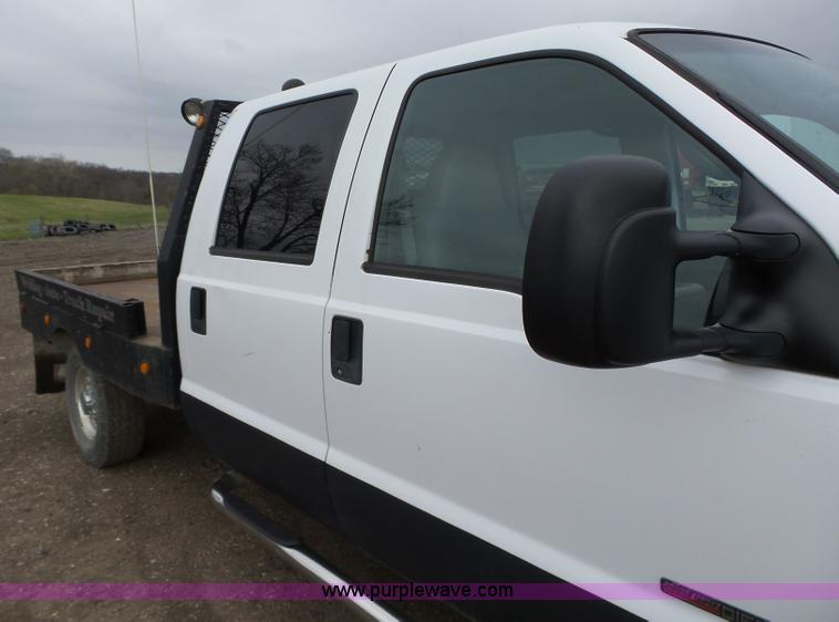 image for item L5690 1999 Ford F250 Super Duty XL Crew Cab flatbed pickup truck