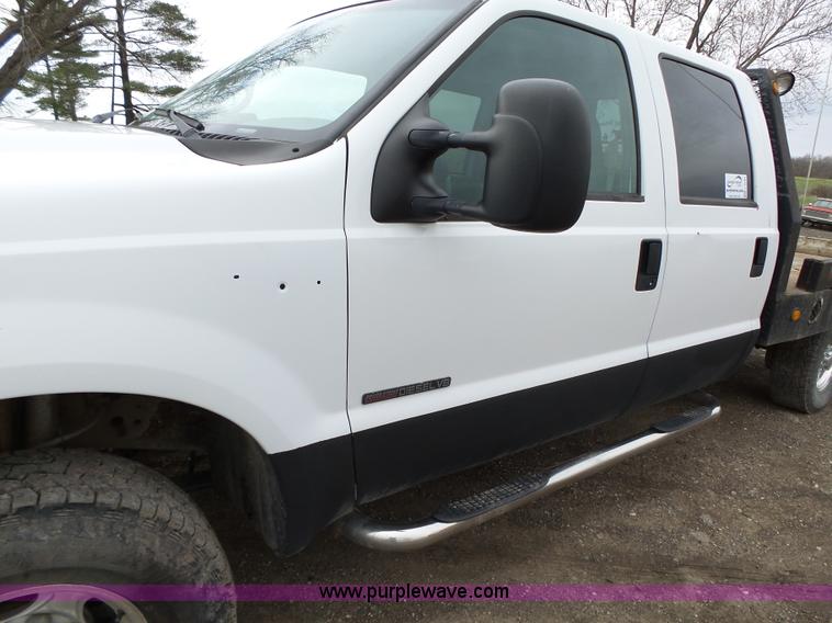 image for item L5690 1999 Ford F250 Super Duty XL Crew Cab flatbed pickup truck