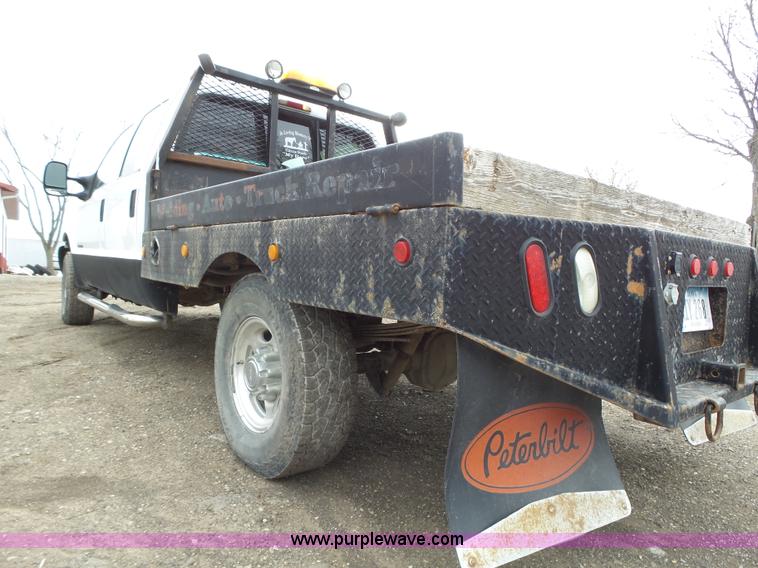 image for item L5690 1999 Ford F250 Super Duty XL Crew Cab flatbed pickup truck