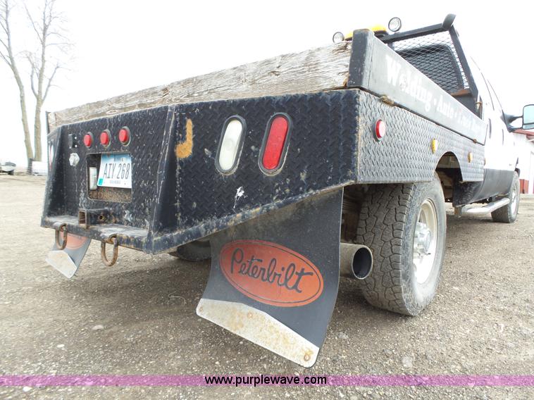 image for item L5690 1999 Ford F250 Super Duty XL Crew Cab flatbed pickup truck