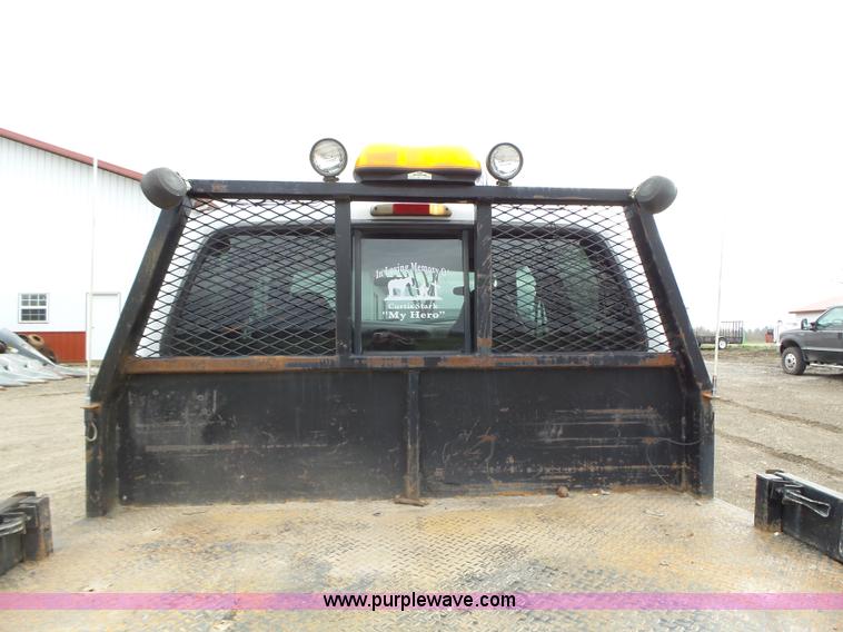 image for item L5690 1999 Ford F250 Super Duty XL Crew Cab flatbed pickup truck