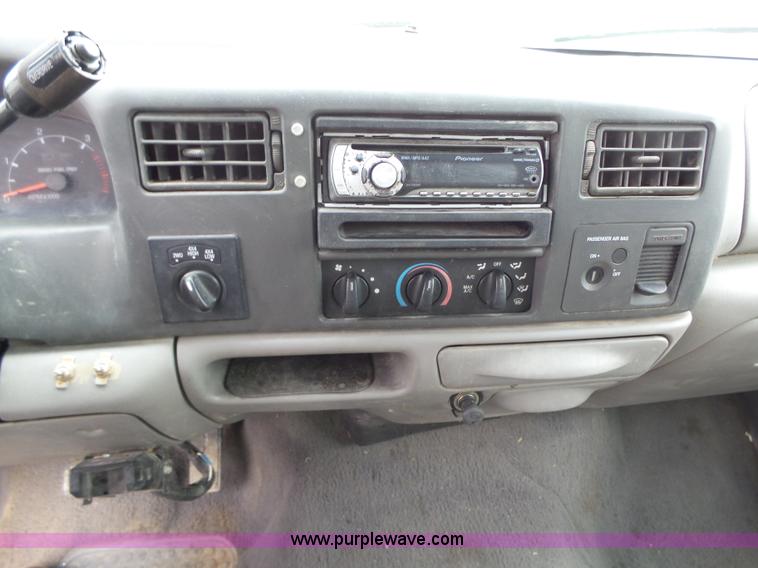 image for item L5690 1999 Ford F250 Super Duty XL Crew Cab flatbed pickup truck