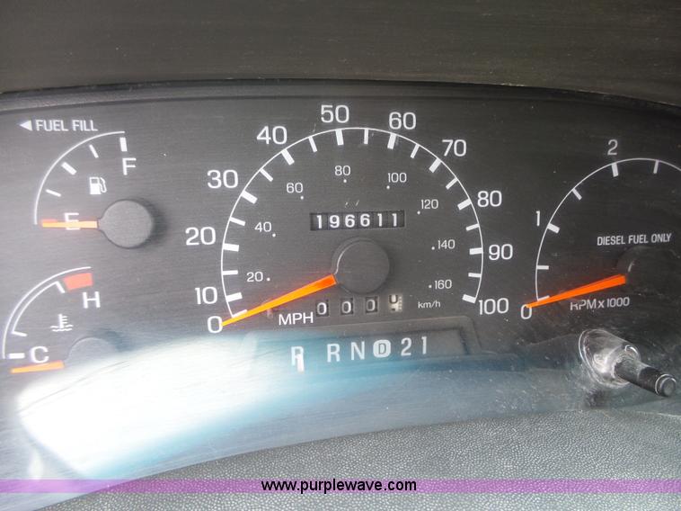 image for item L5690 1999 Ford F250 Super Duty XL Crew Cab flatbed pickup truck