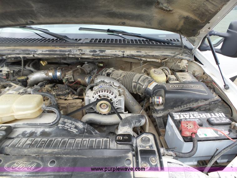 image for item L5690 1999 Ford F250 Super Duty XL Crew Cab flatbed pickup truck