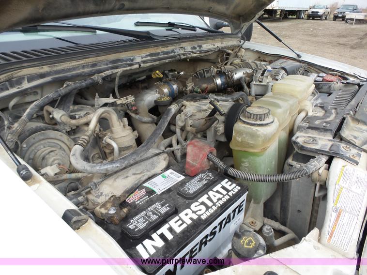 image for item L5690 1999 Ford F250 Super Duty XL Crew Cab flatbed pickup truck