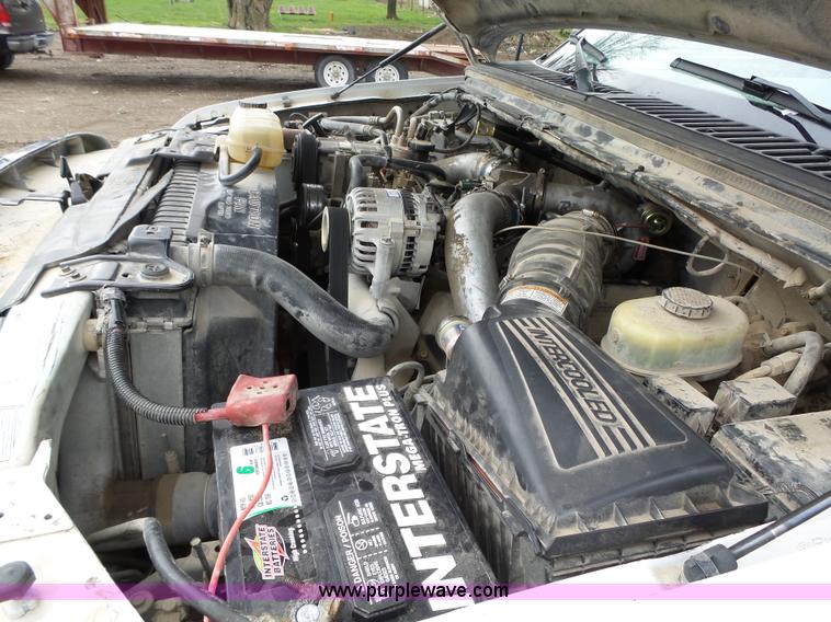 image for item L5690 1999 Ford F250 Super Duty XL Crew Cab flatbed pickup truck