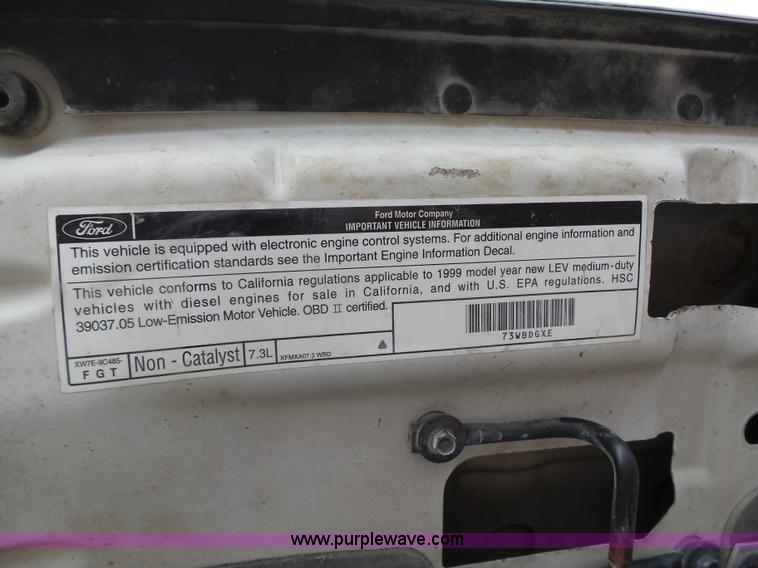 image for item L5690 1999 Ford F250 Super Duty XL Crew Cab flatbed pickup truck