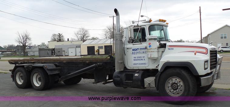 image for item K1339 1997 Mack RD690S roll off truck