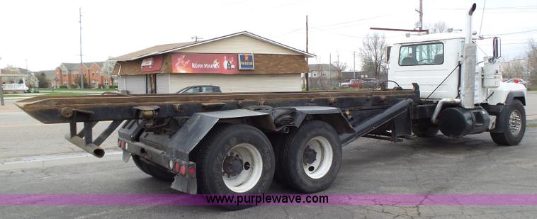 image for item K1339 1997 Mack RD690S roll off truck