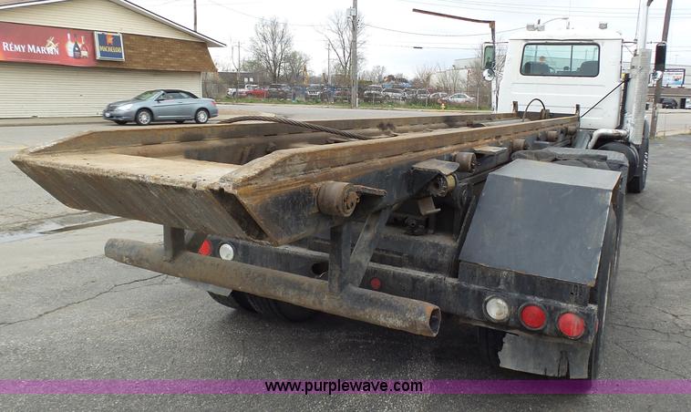 image for item K1339 1997 Mack RD690S roll off truck