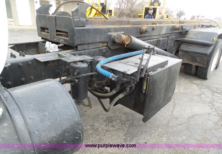 image for item K1339 1997 Mack RD690S roll off truck