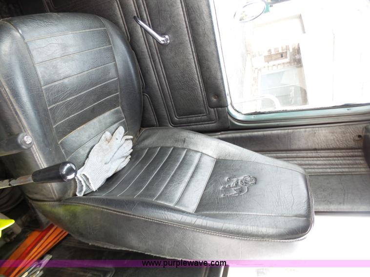 image for item K1339 1997 Mack RD690S roll off truck