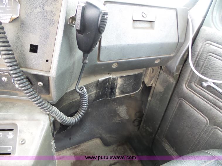 image for item K1339 1997 Mack RD690S roll off truck