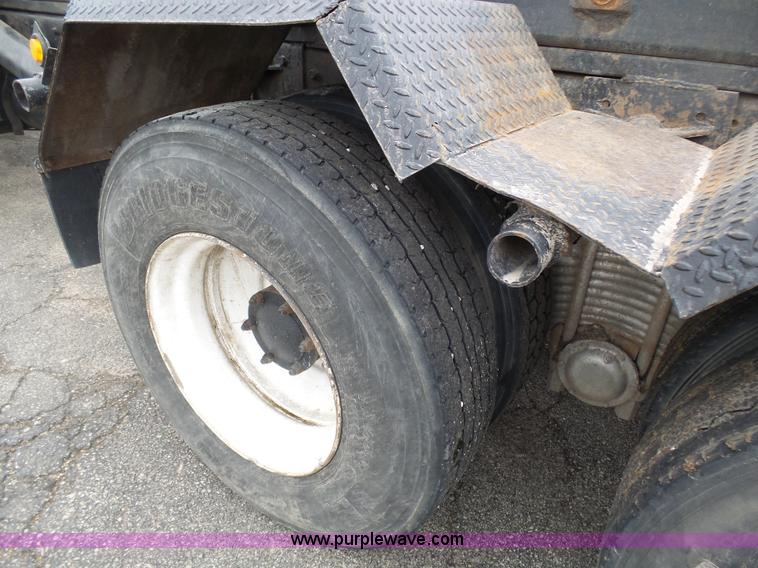 image for item K1339 1997 Mack RD690S roll off truck