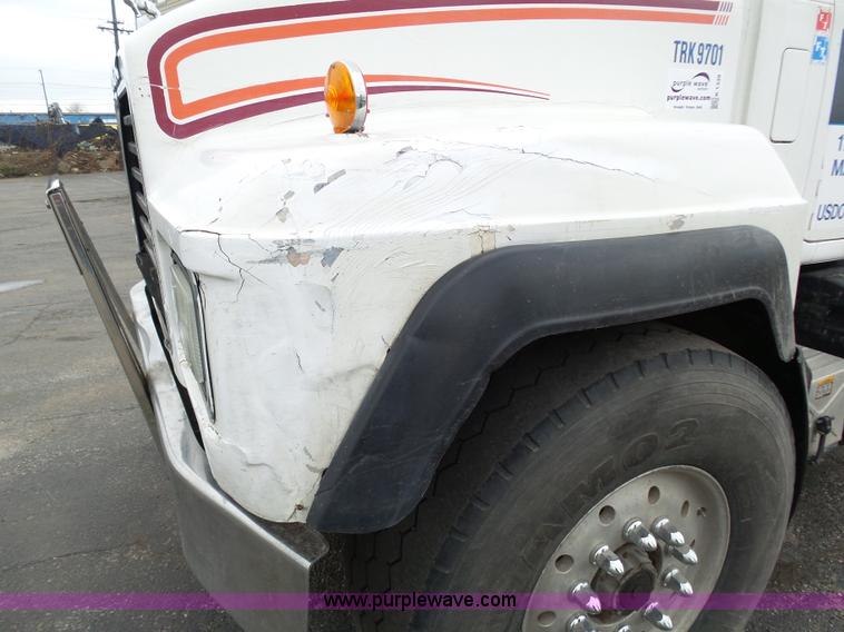 image for item K1339 1997 Mack RD690S roll off truck