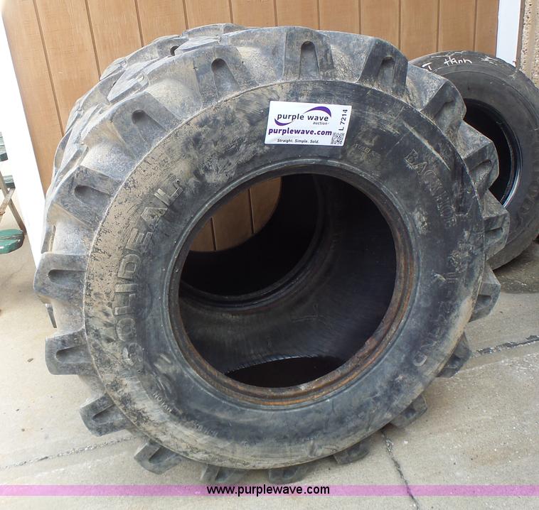 21L24 backhoe tires in Hannibal, MO Item L7214 sold Purple Wave