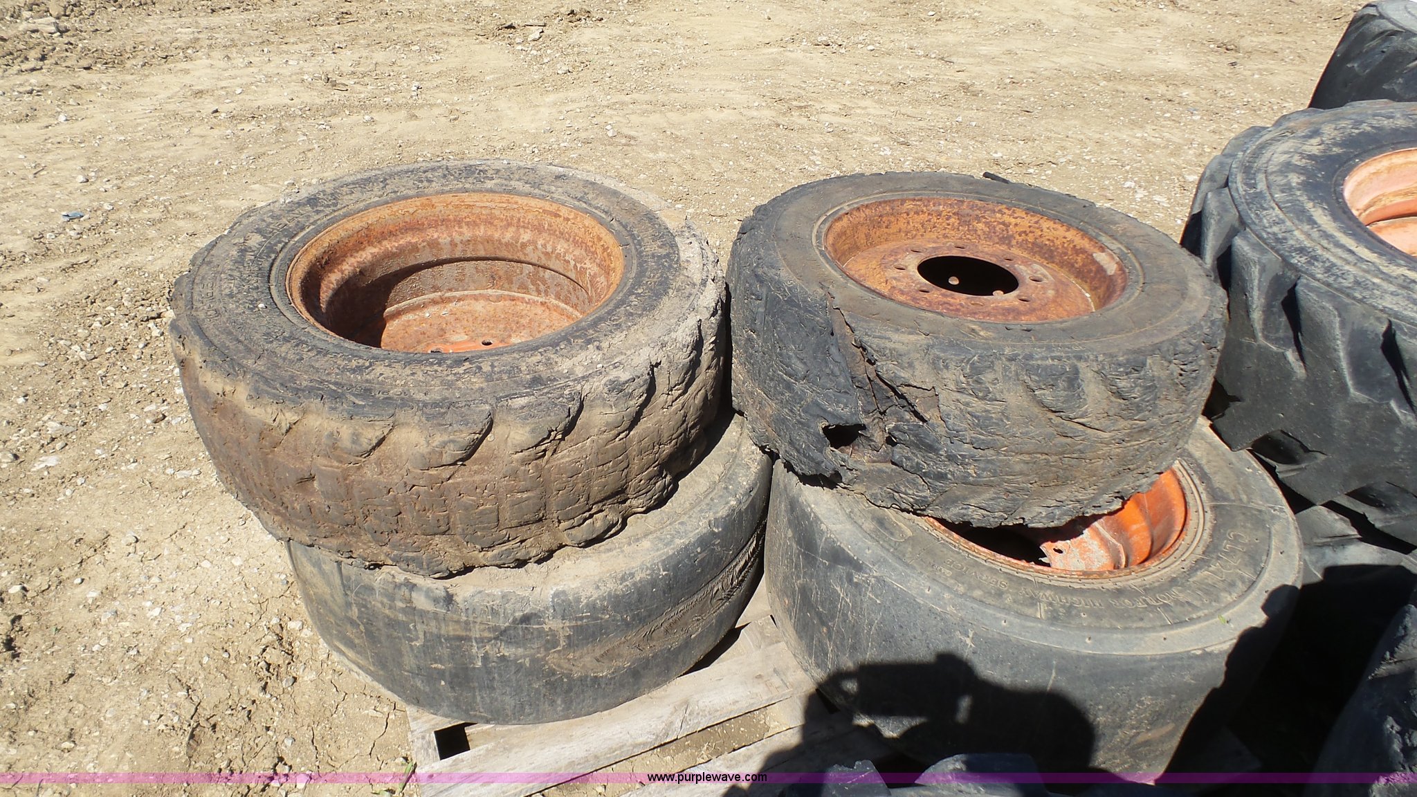 (4) foam filled skid steer tires in Blue Springs, MO Item K4223 sold Purple Wave