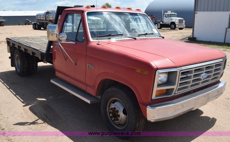 image for item K6746 1985 Ford F350 flatbed pickup truck