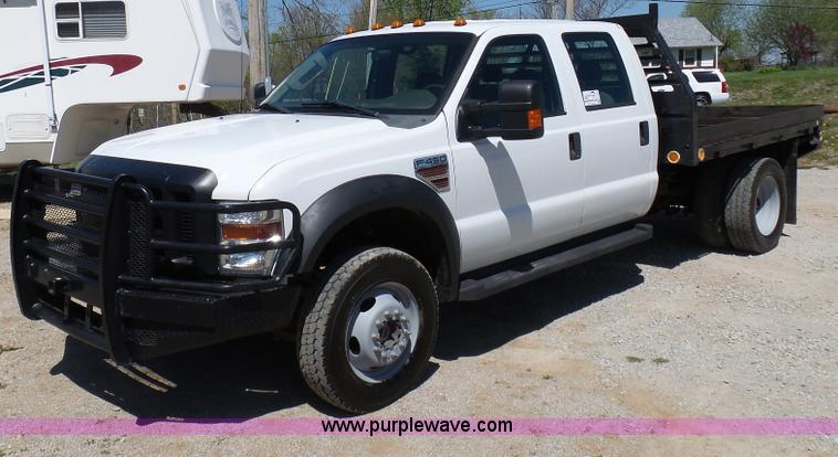 image for item K7997 2010 Ford F450 Super Duty flatbed pickup truck