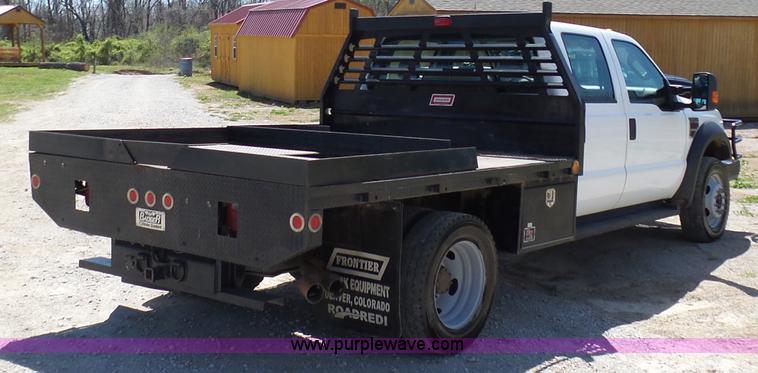 image for item K7997 2010 Ford F450 Super Duty flatbed pickup truck