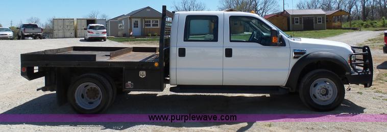 image for item K7997 2010 Ford F450 Super Duty flatbed pickup truck