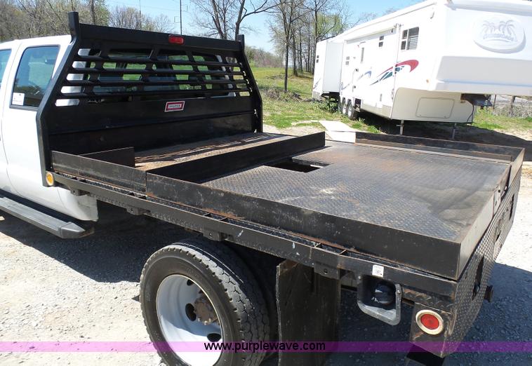 image for item K7997 2010 Ford F450 Super Duty flatbed pickup truck