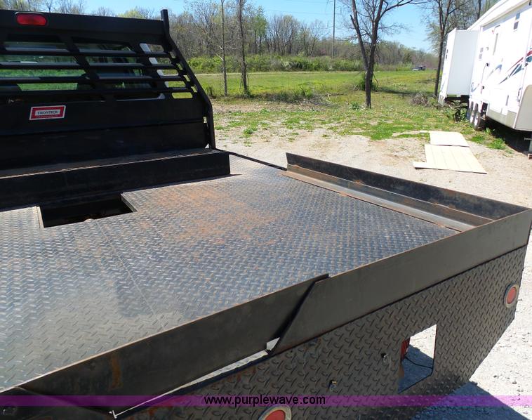 image for item K7997 2010 Ford F450 Super Duty flatbed pickup truck