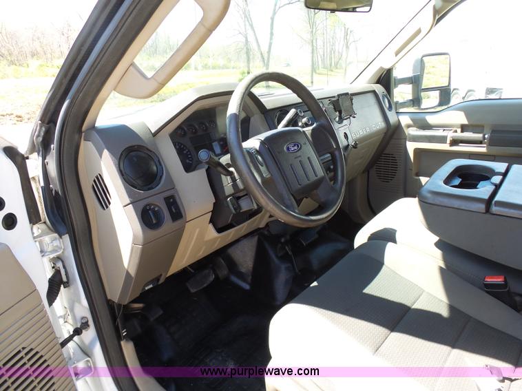 image for item K7997 2010 Ford F450 Super Duty flatbed pickup truck