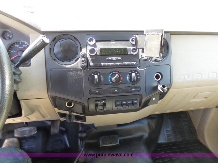 image for item K7997 2010 Ford F450 Super Duty flatbed pickup truck