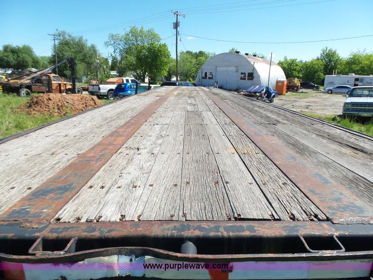 image for item L5810 2002 AMC flatbed trailer