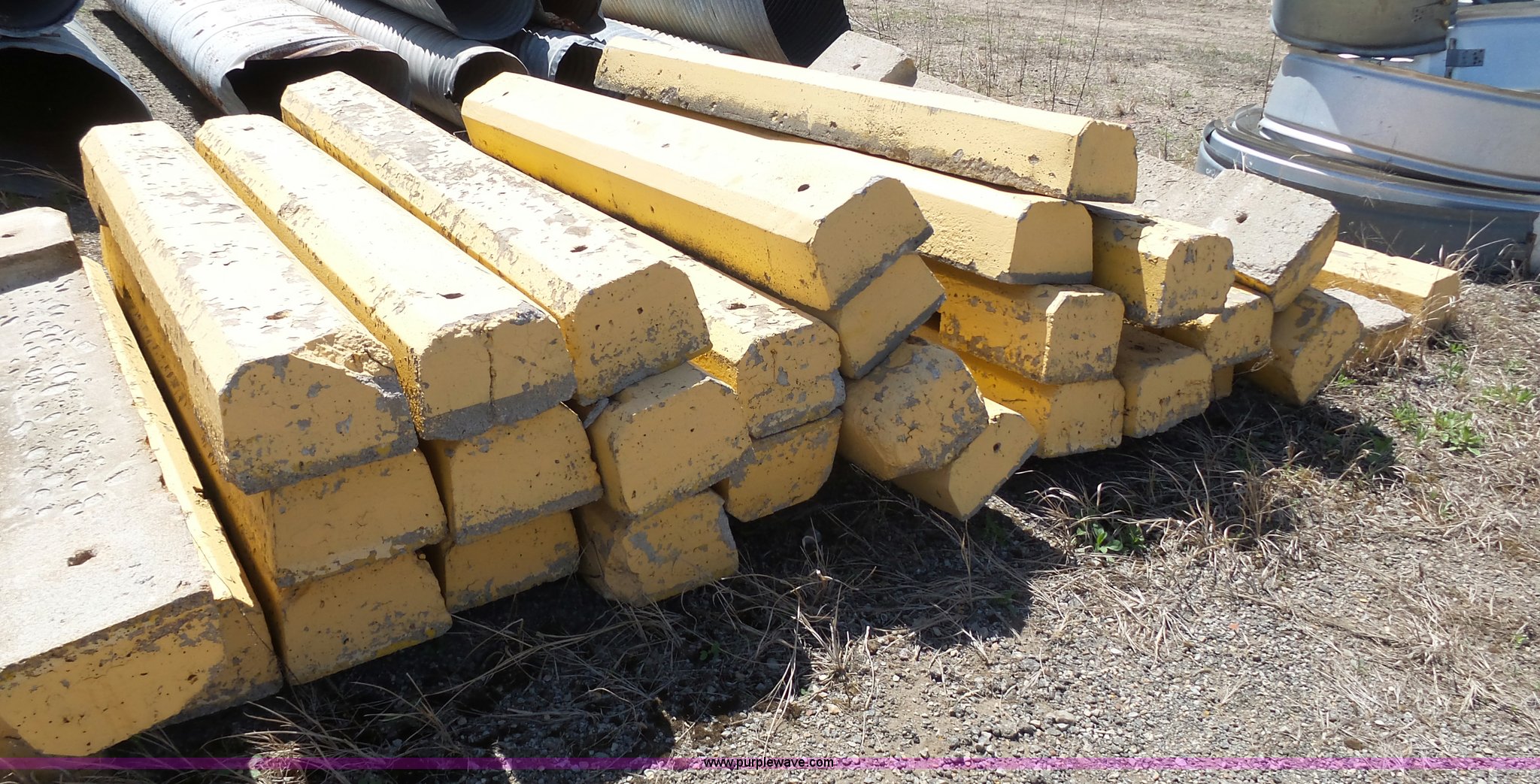 (100) concrete parking blocks in Topeka, KS Item AM9647 sold Purple