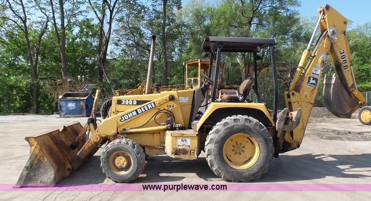 image for item K1378 John Deere 300D backhoe