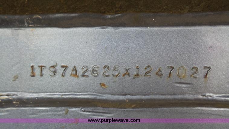 image for item K5219 1999 Travis HRS end dump trailer