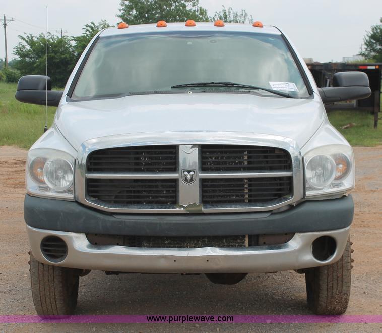 image for item K8885 2007 Dodge Ram 3500HD SLT Quad Cab flatbed pickup truck